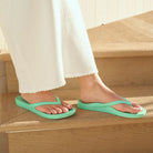 mint arch support thongs with contoured footbeds and ergonomic straps for enhanced comfort and stability.