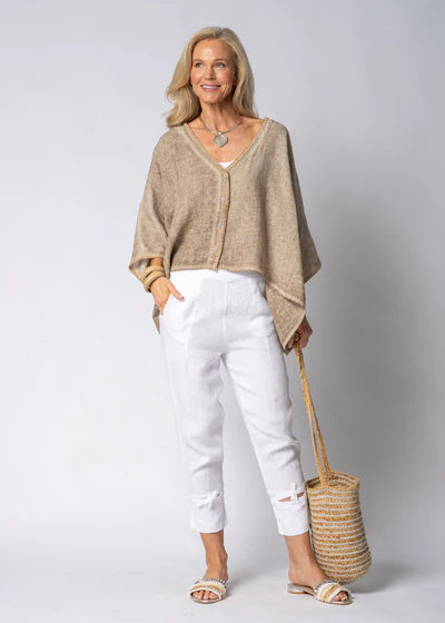 The Mireya Linen Top in Latte. Relaxed, button-up linen blouse with raw-stitched neckline, styled for warm-weather versatility.