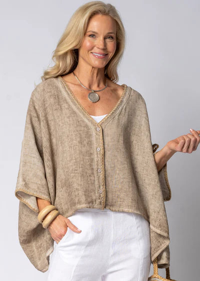 The Mireya Linen Top in Latte. Relaxed, button-up linen blouse with raw-stitched neckline, styled for warm-weather versatility.