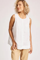 A relaxed, white 100% linen tank top featuring exposed shoulders, contrast decorative topstitching, and a soft A-line silhouette. The design includes a wide cuffed hem and a button closure at the back neck, giving the lightweight, breathable top an effortlessly refined look