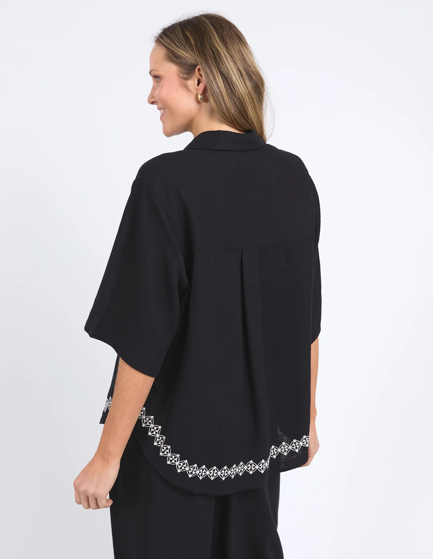 Nina Embroidered Shirt in Black featuring delicate embroidery on the front placket and hemline, made from a soft linen-viscose blend with an oversized fit.