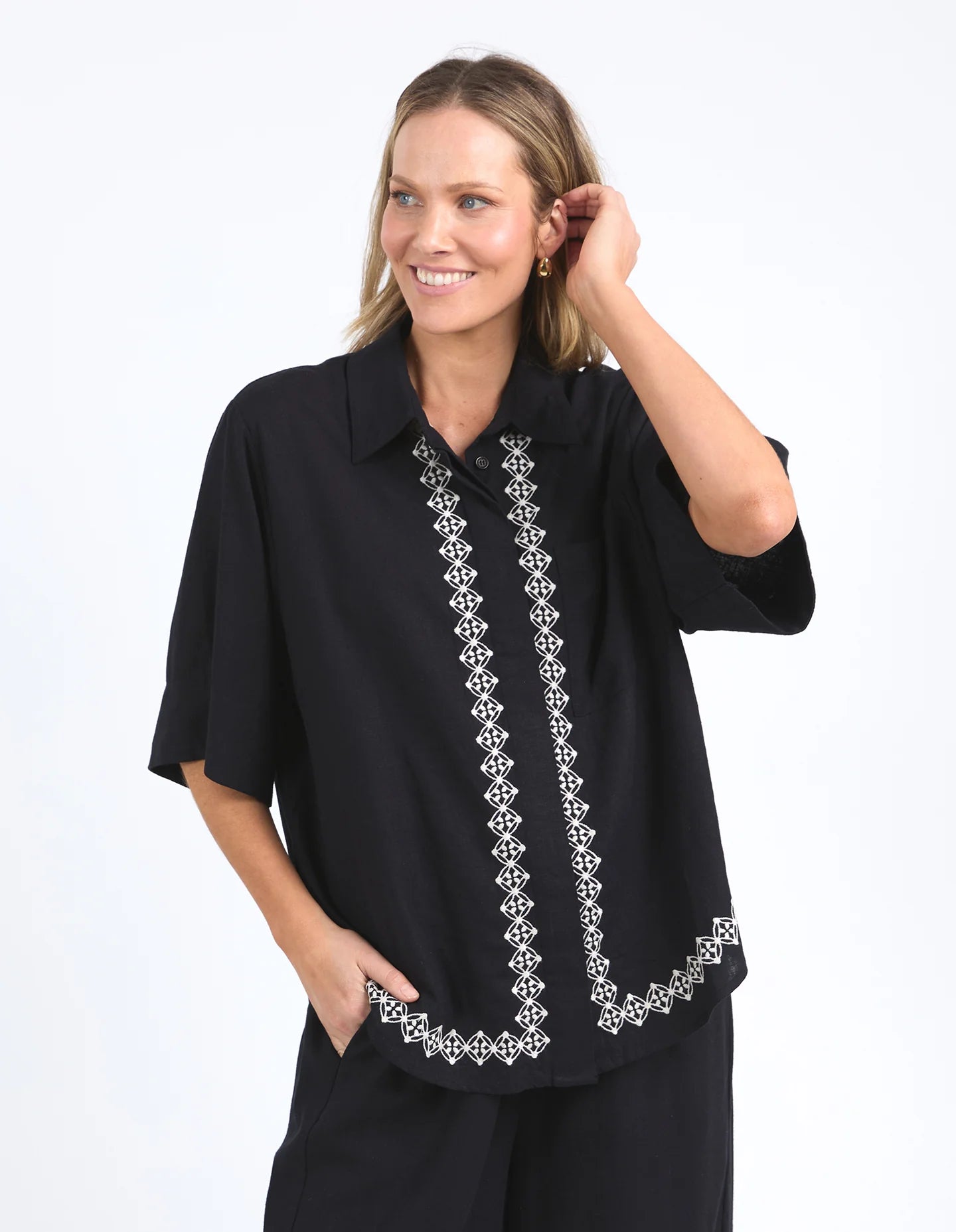 Nina Embroidered Shirt in Black featuring delicate embroidery on the front placket and hemline, made from a soft linen-viscose blend with an oversized fit.