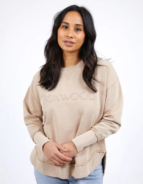 Foxwood Simplified Crew in oatmeal with round neck, raw edge details, and side splits for a relaxed, everyday look.