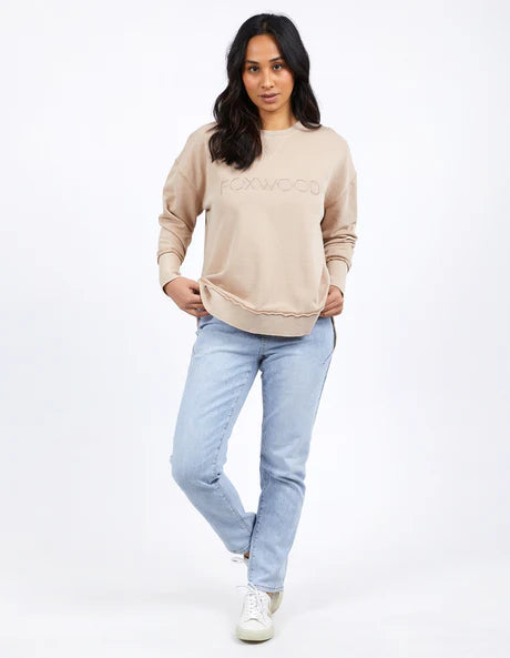 Foxwood Simplified Crew in oatmeal with round neck, raw edge details, and side splits for a relaxed, everyday look.