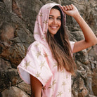 The Palm Surf Poncho is a sand-free, super-absorbent, quick-drying hooded towel. Lightweight, antibacterial, and soft, with a pocket and optional waist tie.