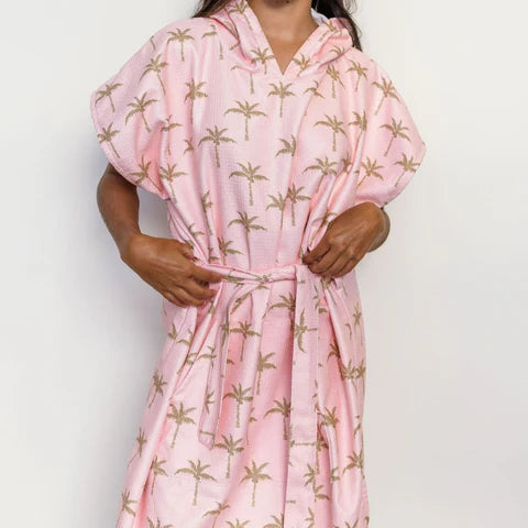 The Palm Surf Poncho is a sand-free, super-absorbent, quick-drying hooded towel. Lightweight, antibacterial, and soft, with a pocket and optional waist tie.