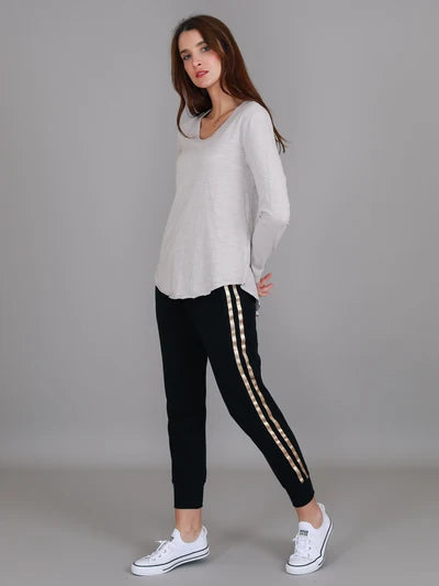 Angora Penola Long Sleeve T-Shirt featuring a crew neckline, relaxed full-length sleeves, straight silhouette and curved raw-edge hi-lo hem.