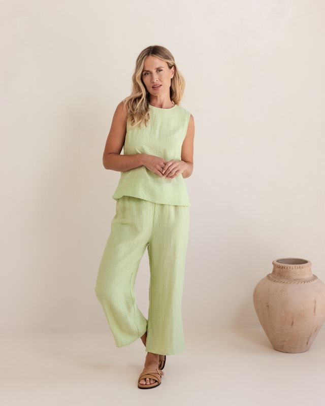 Pistachio linen-rayon top with relaxed fit and flowy silhouette, featuring a subtle back shell detail.