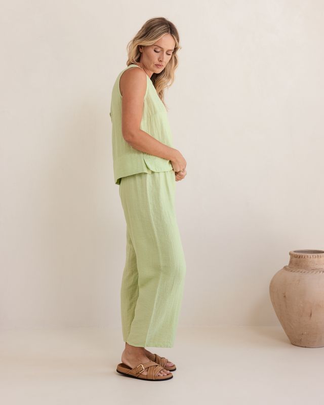Pistachio linen-rayon top with relaxed fit and flowy silhouette, featuring a subtle back shell detail.