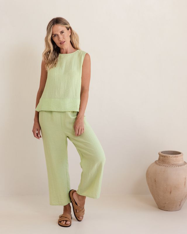 Pistachio linen-rayon top with relaxed fit and flowy silhouette, featuring a subtle back shell detail.