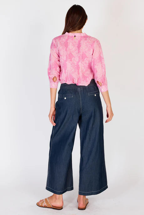 Wide-leg denim palazzo pants with a flat front waistband, elasticated back, and side pockets, offering a relaxed and stylish fit.
