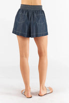 Pula Shorts in white and denim, featuring an elasticated waistband and side pockets.