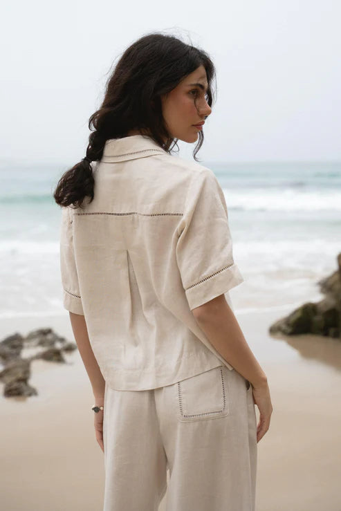 Quinn Linen Shirt in Chalk, featuring a relaxed, boxy fit, cotton lace inserts on the pocket, collar, and cuffs, and finished with French seams for a polished look.