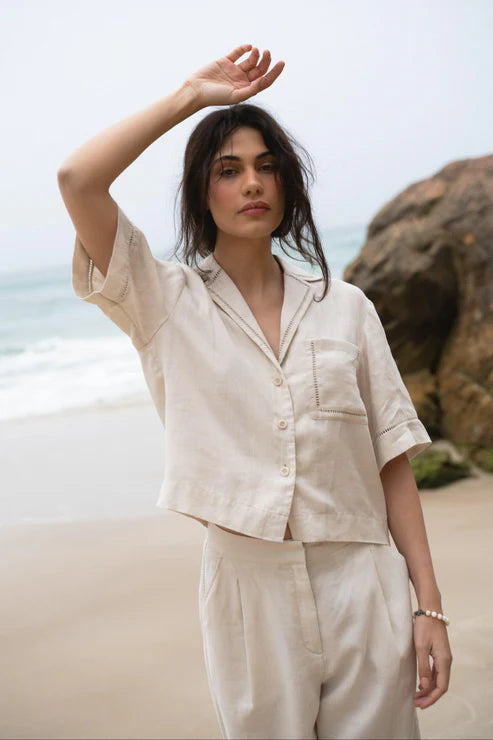 Quinn Linen Shirt in Chalk, featuring a relaxed, boxy fit, cotton lace inserts on the pocket, collar, and cuffs, and finished with French seams for a polished look.