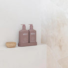 Alive Raspberry Blossom & Juniper Hand & Body Duo in Illuminated White featuring a 500ml hand and body wash and 500ml hand and body lotion in interlocking bottles with a matching tray.
