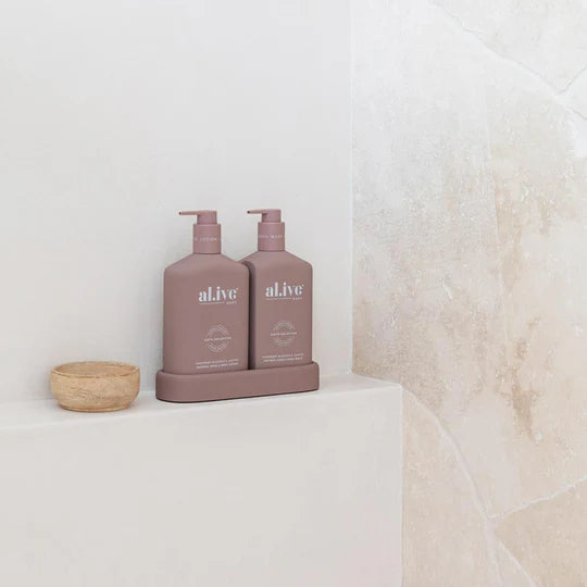 Alive Raspberry Blossom & Juniper Hand & Body Duo in Illuminated White featuring a 500ml hand and body wash and 500ml hand and body lotion in interlocking bottles with a matching tray.
