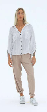 A natural-colored rayon-linen blend shirt with a relaxed silhouette and soft, lightweight drape. Designed with a minimalist look for easy styling, the top offers breathable comfort and effortless versatility for everyday wear