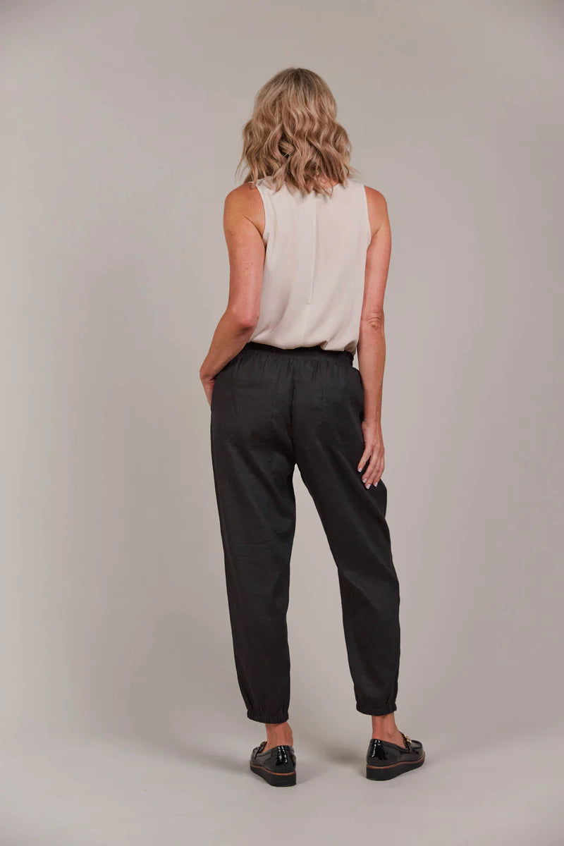 Relaxed-fit pant with an elastic waist, adjustable drawstring, and tapered ankle-length cut, made from a breathable linen-cotton blend for effortless style.