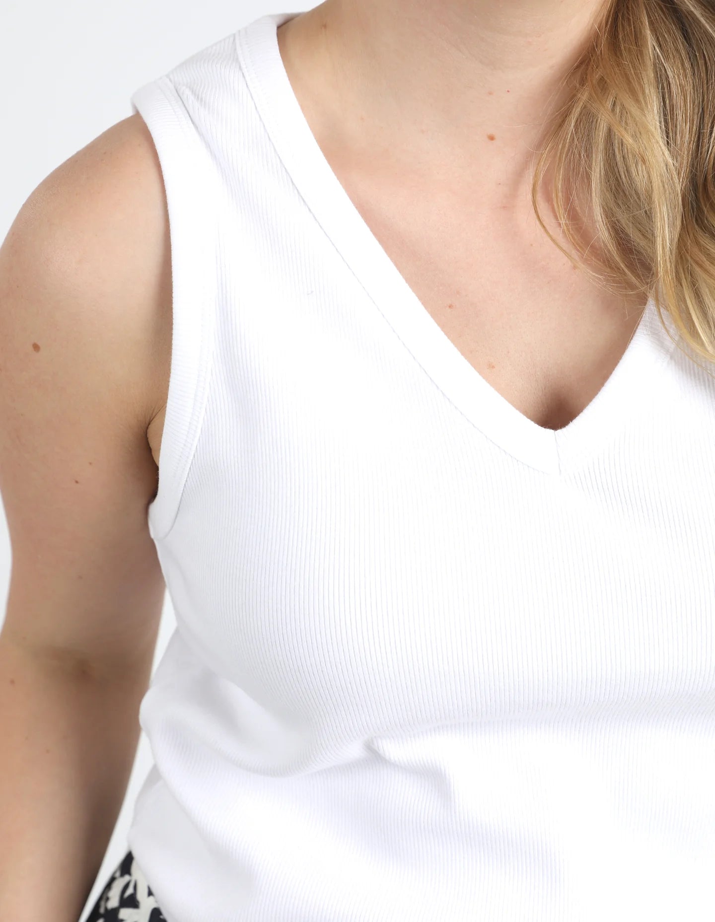 The White Rib Vee Tank by Elm is available at Rawspice Boutique.