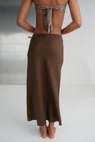 Riley Bias Linen Skirt in Chocolate, midi-length with bias cut, lightly elasticated waist, functional drawstring, and refined French seams.
