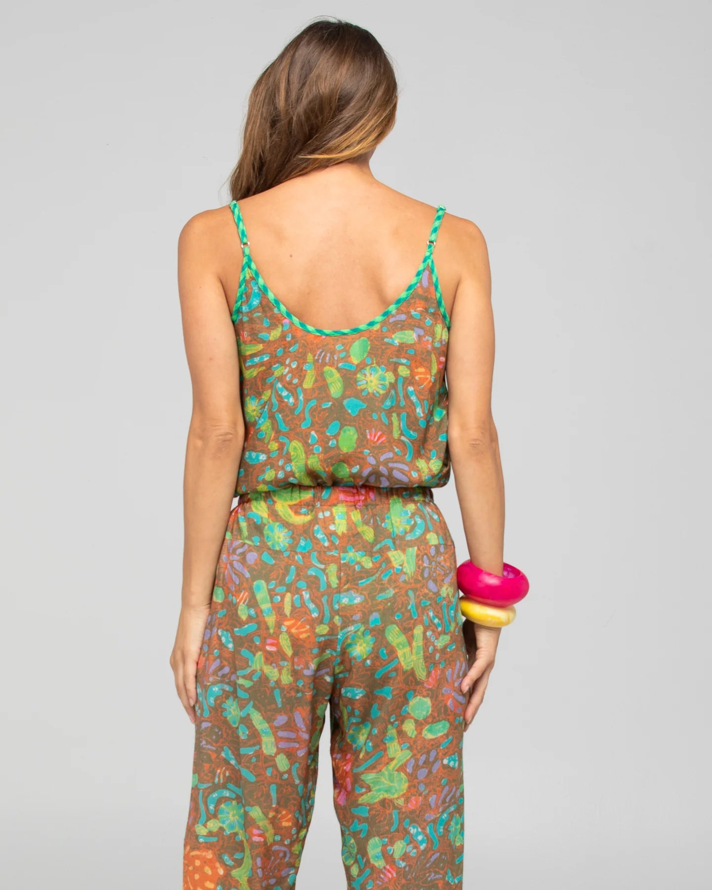 Boom Shankar Rimi Singlet in Rimini print featuring a contrast V-neckline, adjustable straps, and a flowy high-low hem.