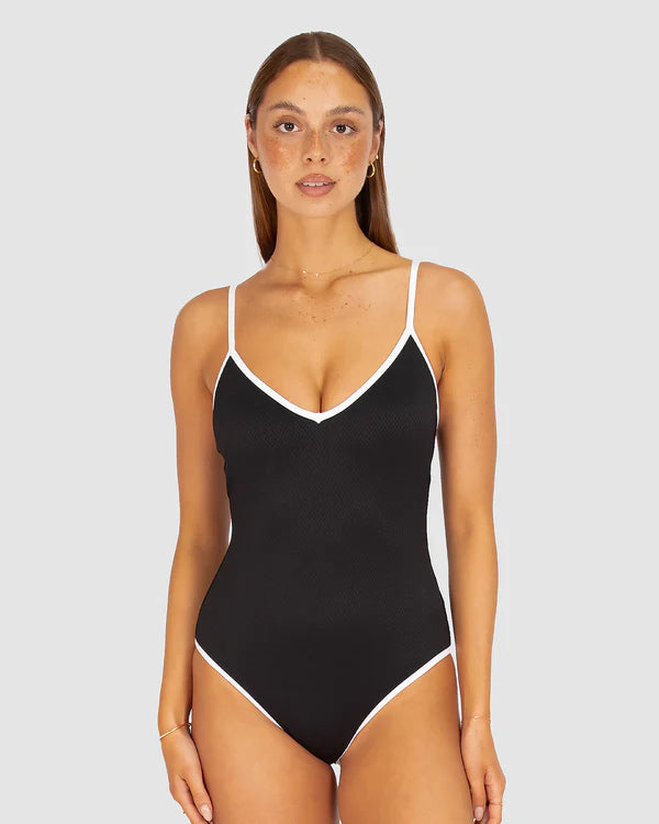A sleek and sophisticated one-piece swimsuit in buttery-soft Rococco fabric, featuring a flattering V-neckline and structured shaping for a confident, elegant fit.