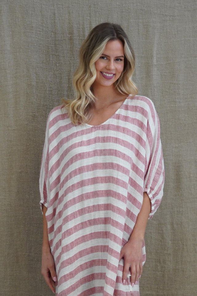 Rosa Elasticated Sleeves Kaftan in rose pink with white stripes, made from 100% plain and mesh linen. Features a relaxed silhouette, breathable fabric, and elasticated sleeves, evoking a sophisticated coastal vibe.