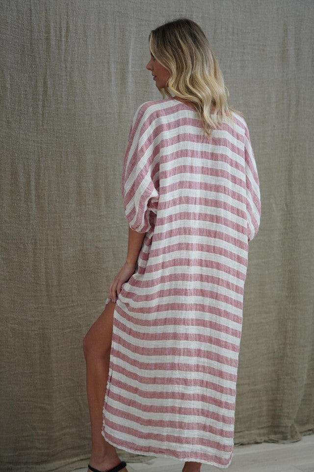 Rosa Elasticated Sleeves Kaftan in rose pink with white stripes, made from 100% plain and mesh linen. Features a relaxed silhouette, breathable fabric, and elasticated sleeves, evoking a sophisticated coastal vibe.