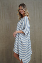 Rosa Elasticated Sleeves Kaftan in cornflower blue with white stripes, made from 100% plain and mesh linen. Features a relaxed silhouette, breathable fabric, and elasticated sleeves, evoking a sophisticated coastal vibe.