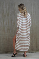 Rosa Elasticated Sleeves Kaftan in antique rust with white stripes, made from 100% plain and mesh linen. Features a relaxed silhouette, breathable fabric, and elasticated sleeves, evoking a sophisticated coastal vibe.