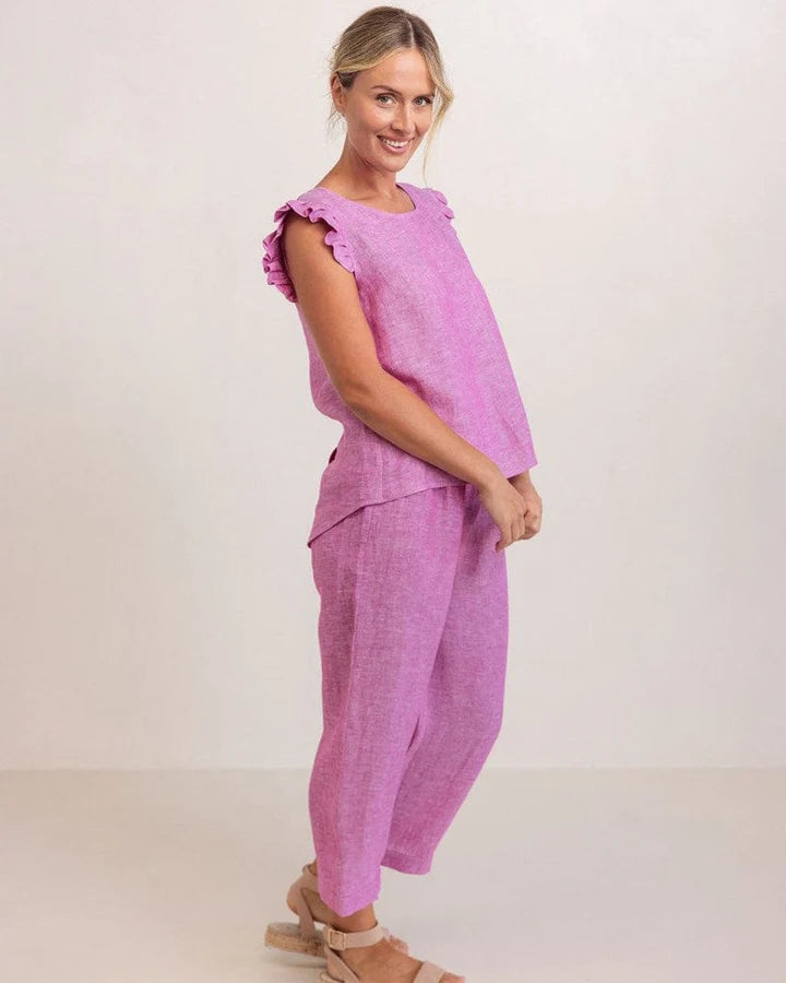 See Saw women’s top in raspberry, featuring soft ruffle sleeves and a decorative button-back design made from a linen-viscose blend.