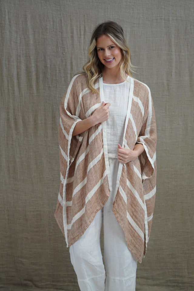 The Rust & White Stripes Carmen Cardigan by Rustic Linen is currently available at Rawspice Boutique.