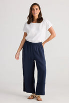 A woman modelling Sailor Pants Wide Leg in Navy by Holiday