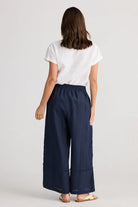 A woman modelling Sailor Pants Wide Leg in Navy by Holiday from behind