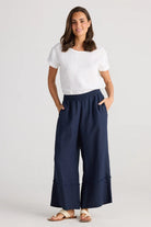 A woman modelling Sailor Pants Wide Leg in Navy by Holiday