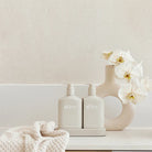 Alive Sea Cotton & Coconut Hand & Body Duo in Illuminated White featuring a 500ml hand and body wash and 500ml hand and body lotion in interlocking bottles with a matching tray.
