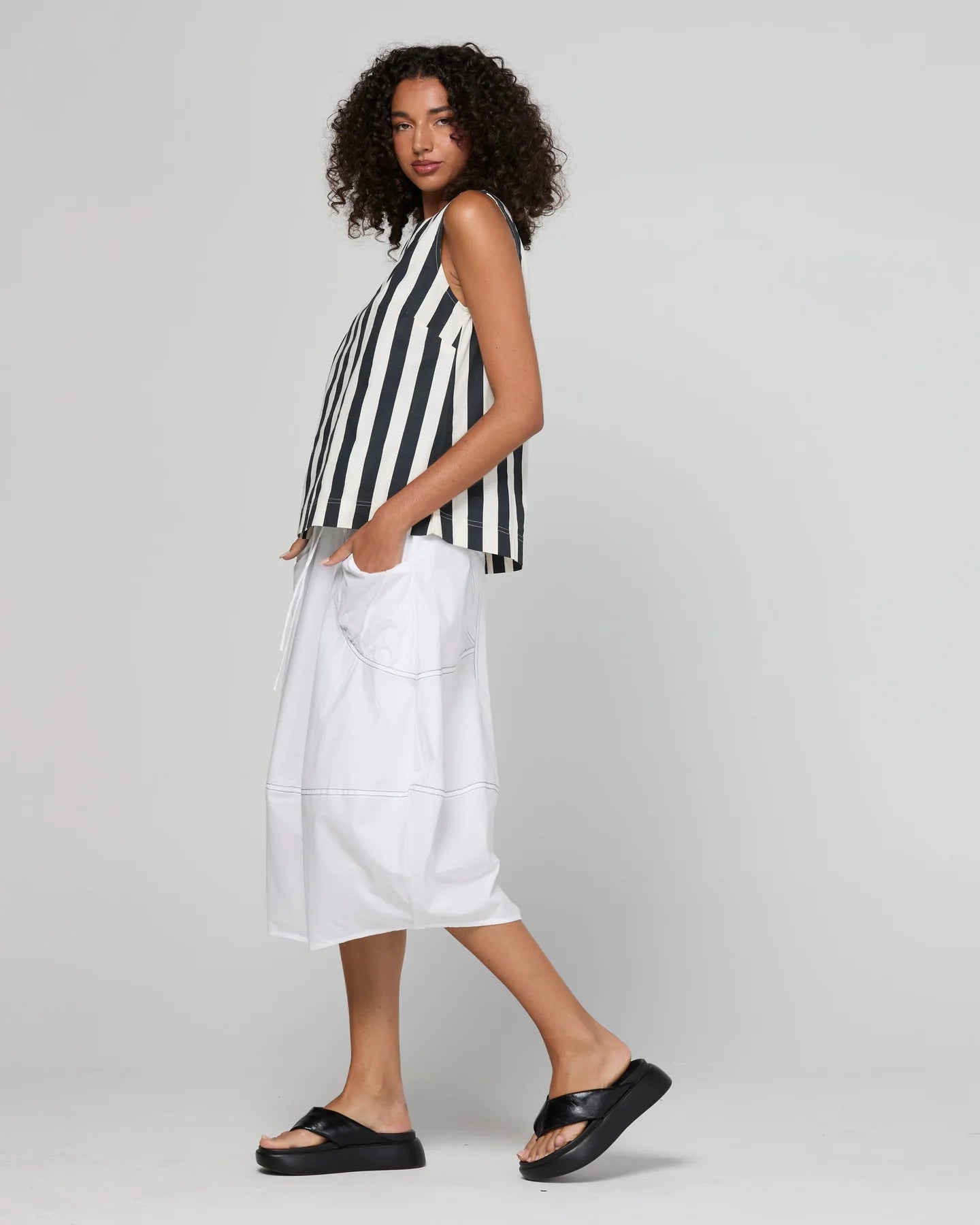 Shiro Top in Mono Stripe featuring a sleeveless design, relaxed A-line fit, round neckline and back keyhole detail.