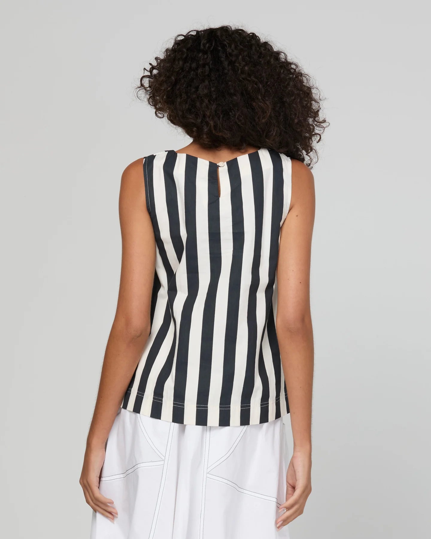 Shiro Top in Mono Stripe featuring a sleeveless design, relaxed A-line fit, round neckline and back keyhole detail.
