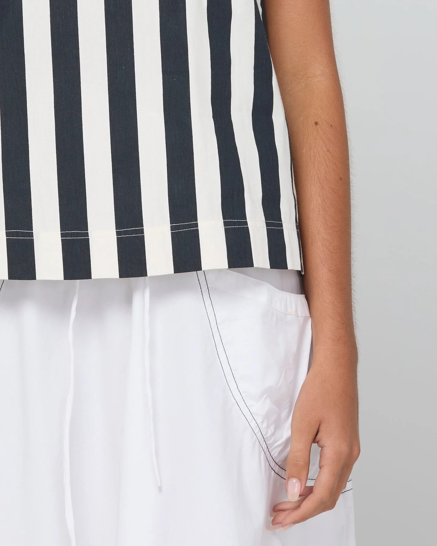 Shiro Top in Mono Stripe featuring a sleeveless design, relaxed A-line fit, round neckline and back keyhole detail.