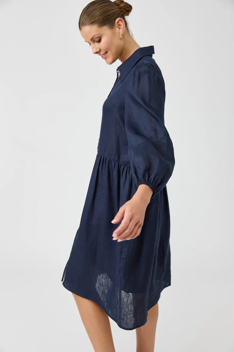 Navy midi shirt dress with a button-down front, long balloon sleeves, and a contrast ribbon detail, crafted from luxurious linen for a relaxed yet chic look.