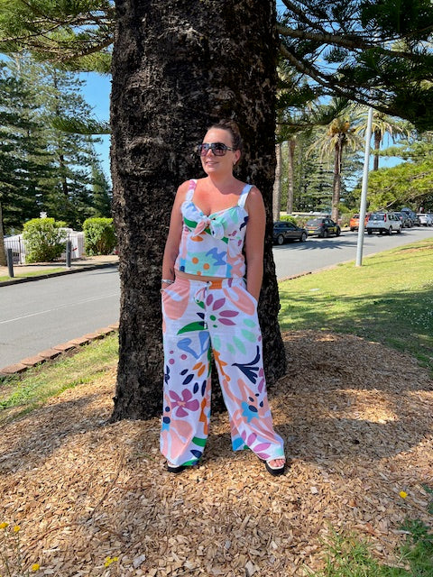 Boom Shankar Harper Pant in Sorrento, lightweight cotton pant with a mid-rise elastic waistband, tapered leg, and bold blue and white geometric print.