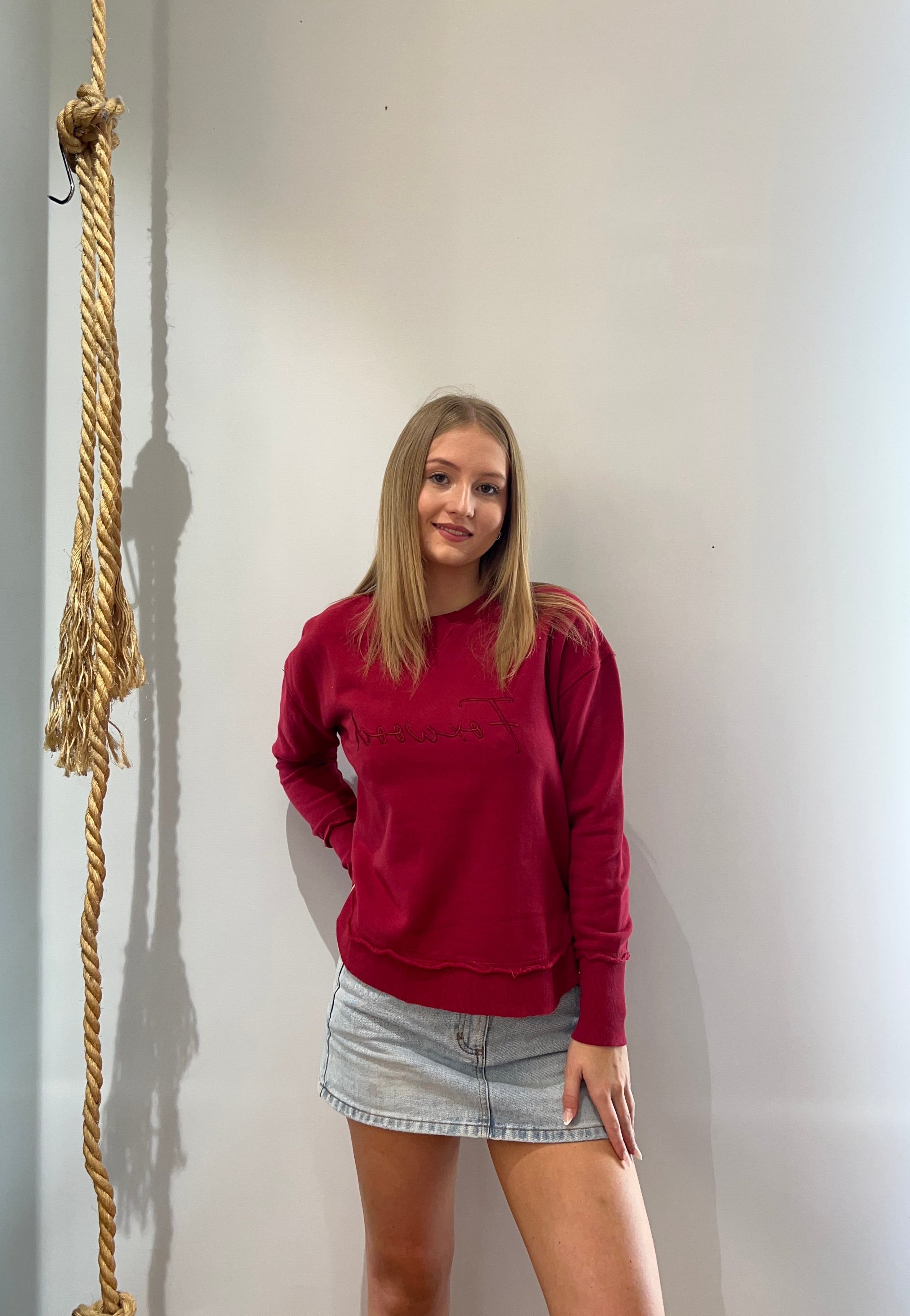 Foxwood Signature Crew in Rhubarb Red featuring front chest embroidery, raw edge detailing, a curved hem and soft 100% cotton fabric.
