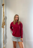 Foxwood Signature Crew in Rhubarb Red featuring front chest embroidery, raw edge detailing, a curved hem and soft 100% cotton fabric.
