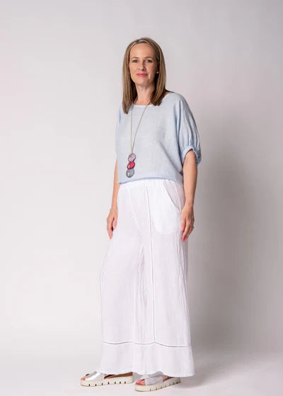 Solene Linen Top in baby blue with a relaxed fit, round neckline, elasticated mid-length sleeves and a lightweight linen finish.