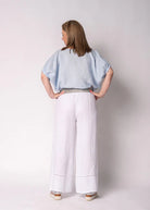 Solene Linen Top in baby blue with a relaxed fit, round neckline, elasticated mid-length sleeves and a lightweight linen finish.