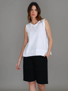 White Sonya Tank featuring a crew neckline, wide shoulder straps, relaxed cropped fit and raw-edge rib hem.