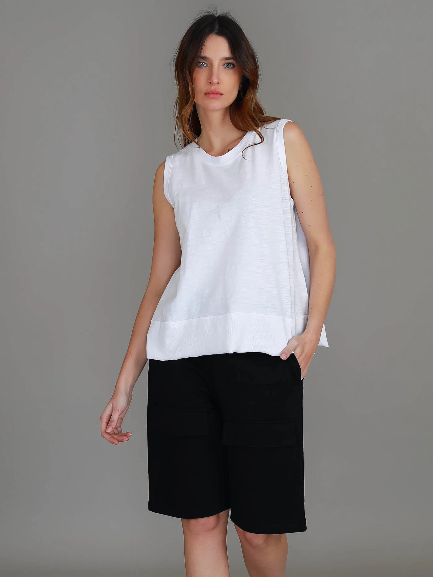 White Sonya Tank featuring a crew neckline, wide shoulder straps, relaxed cropped fit and raw-edge rib hem.