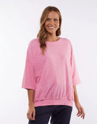 The Super Pink Fundamental Mazie Sweat by Elm is available at Rawspice Boutique.