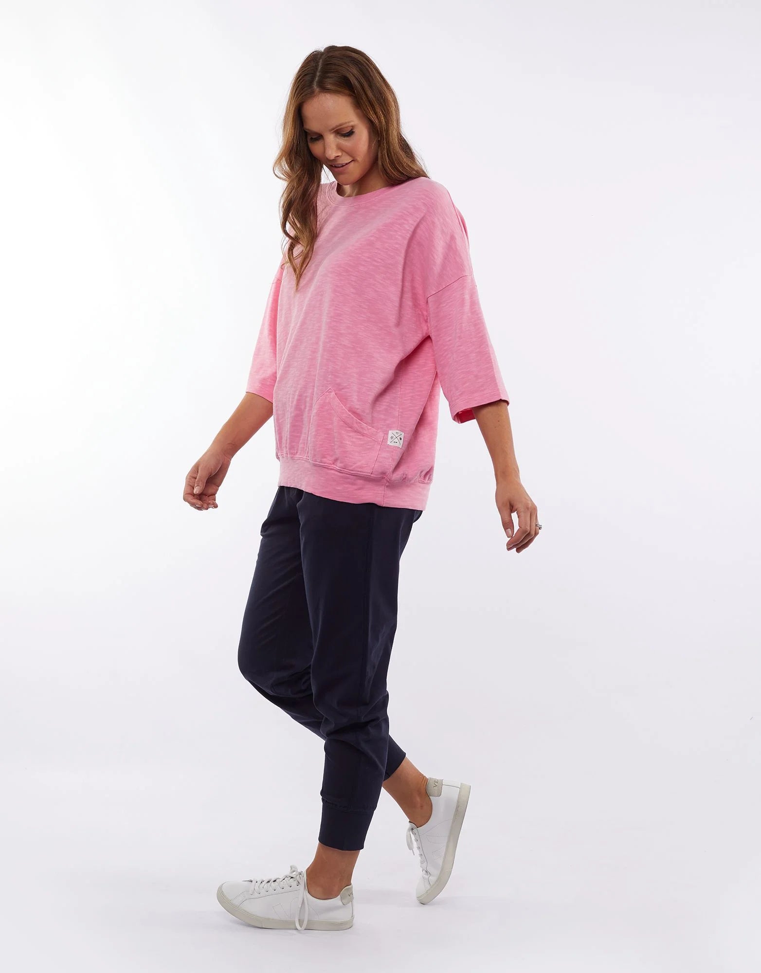 The Super Pink Fundamental Mazie Sweat by Elm is available at Rawspice Boutique.