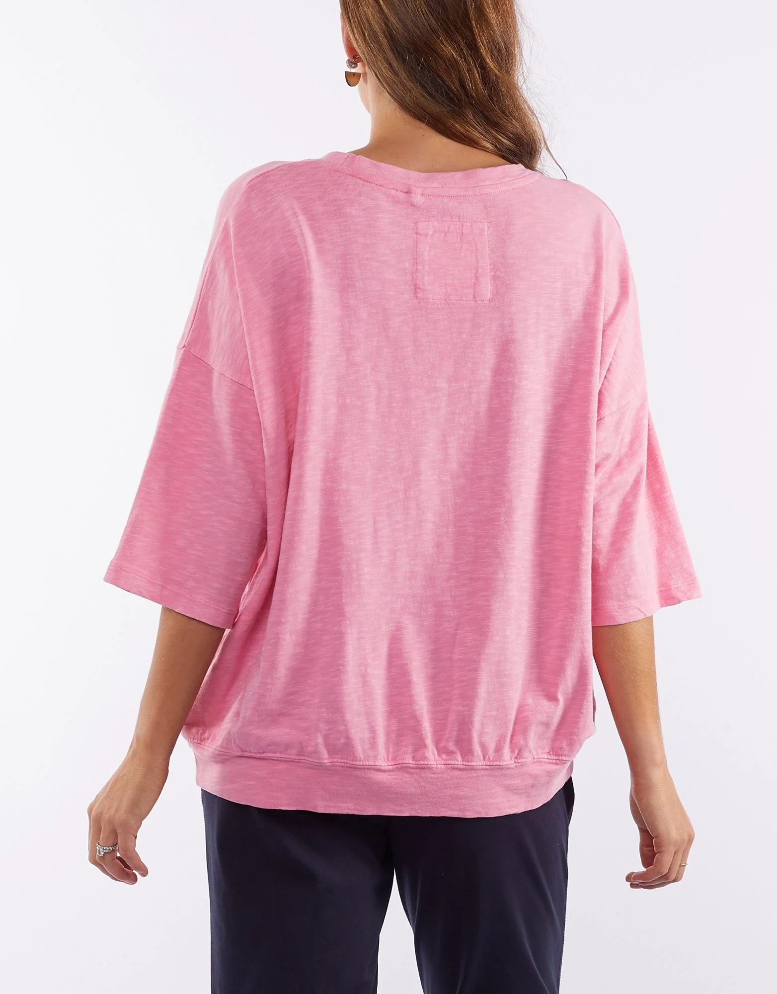 The Super Pink Fundamental Mazie Sweat by Elm is available at Rawspice Boutique.